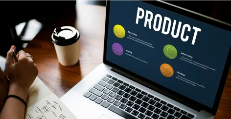 Laptop showing a product presentation slide beside a coffee cup