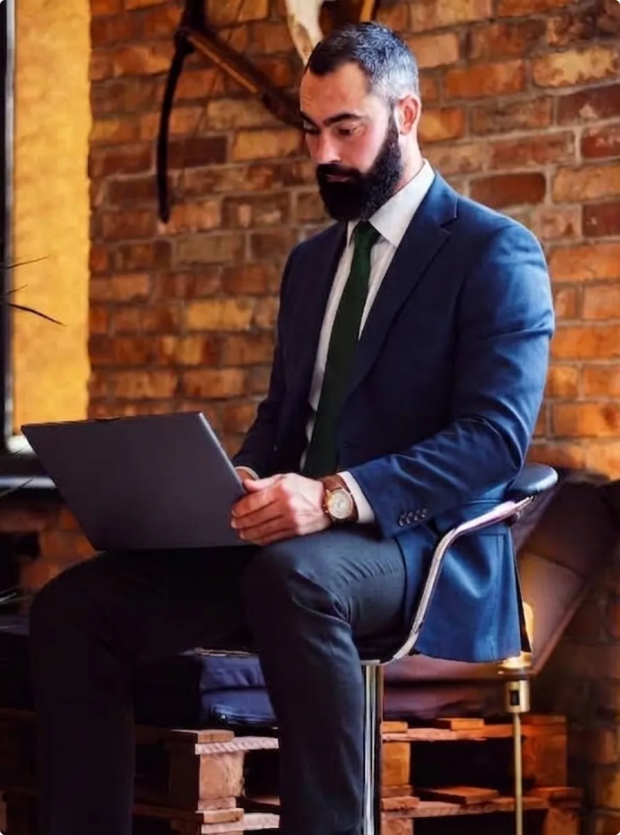 A professional developing a digital campaign on a laptop