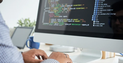 Code on a developer's monitor