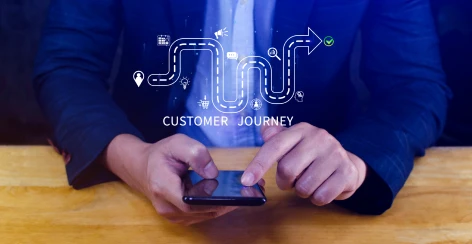 Customer journey map graphic over a smartphone